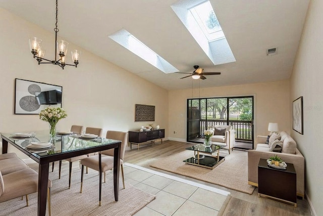 6263 93rd Ter N Unit 4202, Pinellas Park, FL 33782 - living room featuring a skylight, light wood finished floors, a chandelier, and high vaulted ceiling