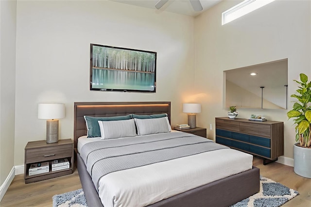 6263 93rd Ter N Unit 4202, Pinellas Park, FL 33782 - bedroom with wood finished floors and a ceiling fan