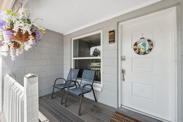 8897 54th St N, Pinellas Park, FL 33782 - view of exterior entry with a porch and concrete block siding