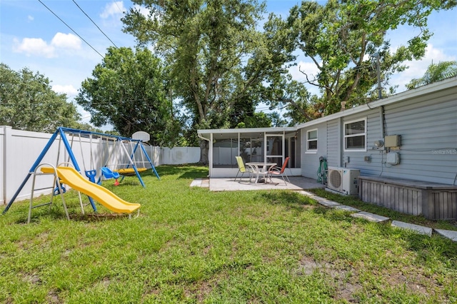 8897 54th St N, Pinellas Park, FL 33782 - fenced backyard with a sunroom, a playground, and a patio area
