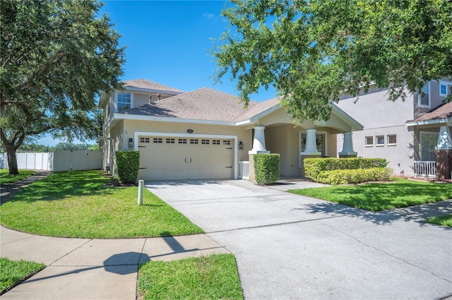 5102 Pheasant Woods Dr, Lutz, FL 33558 - view of front of home with a garage, concrete driveway, stucco siding, and roof with shingles