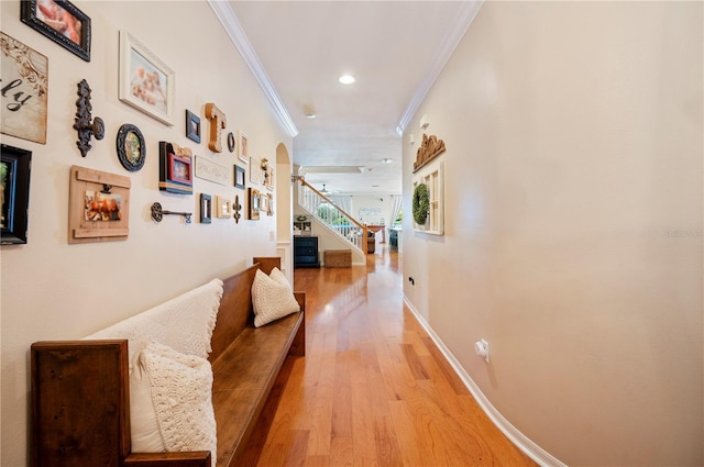 5102 Pheasant Woods Dr, Lutz, FL 33558 - corridor featuring ornamental molding, light wood finished floors, arched walkways, stairway, and recessed lighting