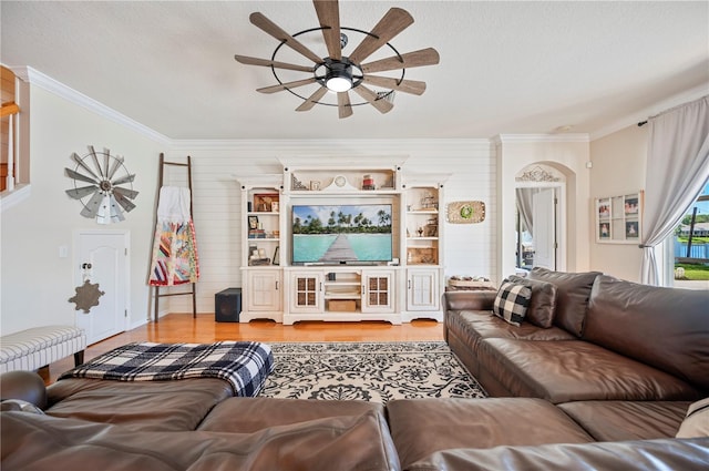5102 Pheasant Woods Dr, Lutz, FL 33558 - living area with ceiling fan, ornamental molding, wooden walls, wood finished floors, and a textured ceiling