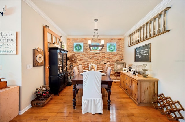 5102 Pheasant Woods Dr, Lutz, FL 33558 - dining space with brick wall, light wood-type flooring, and ornamental molding