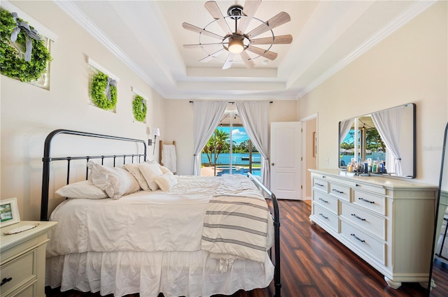5102 Pheasant Woods Dr, Lutz, FL 33558 - bedroom featuring access to outside, a tray ceiling, dark wood-style floors, a ceiling fan, and crown molding