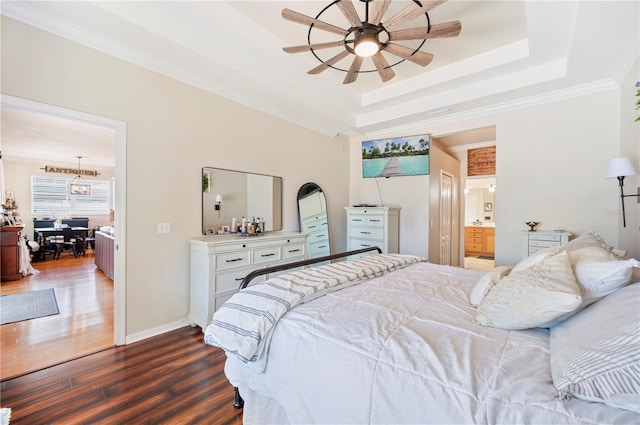 5102 Pheasant Woods Dr, Lutz, FL 33558 - bedroom featuring dark wood-style floors, a raised ceiling, ensuite bath, ceiling fan, and crown molding