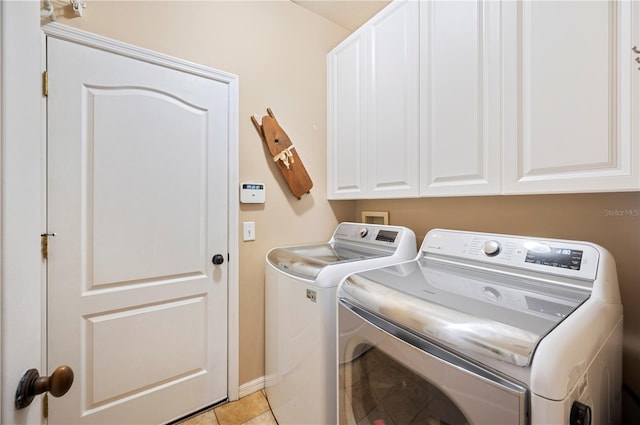5102 Pheasant Woods Dr, Lutz, FL 33558 - washroom featuring separate washer and dryer, cabinet space, and light tile patterned floors