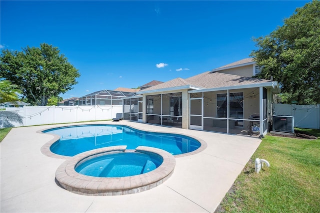 5102 Pheasant Woods Dr, Lutz, FL 33558 - view of pool featuring a sunroom, a fenced backyard, a pool with connected hot tub, a gate, and a patio