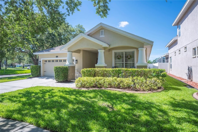 5102 Pheasant Woods Dr, Lutz, FL 33558 - view of front facade featuring stucco siding, an attached garage, driveway, and a front lawn
