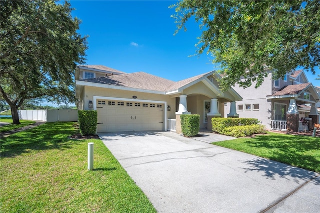 5102 Pheasant Woods Dr, Lutz, FL 33558 - view of front of property with stucco siding, an attached garage, and concrete driveway