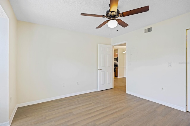 302 Lake Parsons Grn Unit 104, Brandon, FL 33511 - spare room with ceiling fan and light wood-style flooring