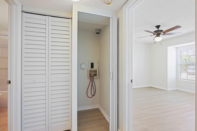 302 Lake Parsons Grn Unit 104, Brandon, FL 33511 - corridor featuring a textured ceiling and light wood finished floors
