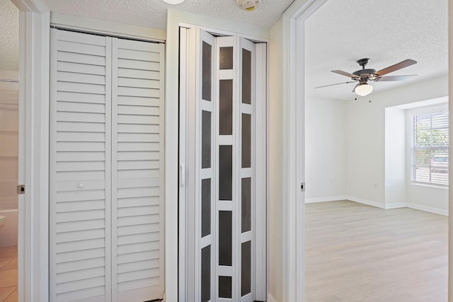 302 Lake Parsons Grn Unit 104, Brandon, FL 33511 - detailed view of a textured ceiling, wood finished floors, and ceiling fan