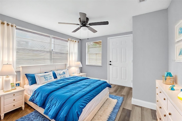 3330 Rock Royal Dr, Holiday, FL 34691 - bedroom featuring wood finished floors and a ceiling fan