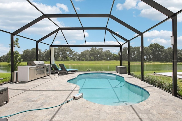 9107 Rally Spring Loop, Wesley Chapel, FL 33545 - outdoor pool with an outdoor kitchen, a patio, a water view, and view of wooded area