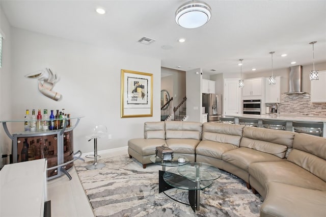 9107 Rally Spring Loop, Wesley Chapel, FL 33545 - living room with recessed lighting and stairway
