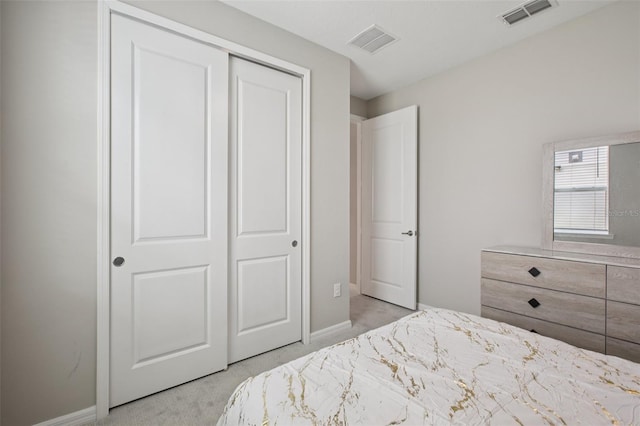 9107 Rally Spring Loop, Wesley Chapel, FL 33545 - bedroom with light colored carpet and a closet