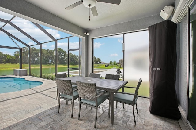 9107 Rally Spring Loop, Wesley Chapel, FL 33545 - sunroom / solarium with a ceiling fan, a pool, outdoor dining space, and view of golf course