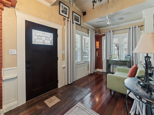 2504 W N A St Unit A, Tampa, FL 33609 - foyer featuring dark wood-style floors, a wainscoted wall, ornamental molding, a decorative wall, and a ceiling fan