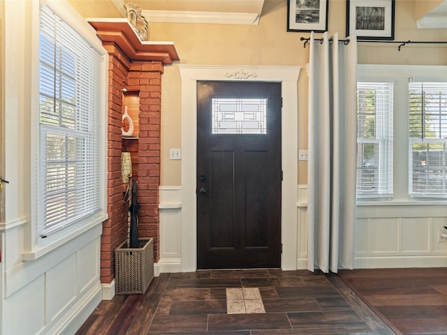 2504 W N A St Unit A, Tampa, FL 33609 - entryway featuring a decorative wall, crown molding, dark wood-style flooring, and wainscoting