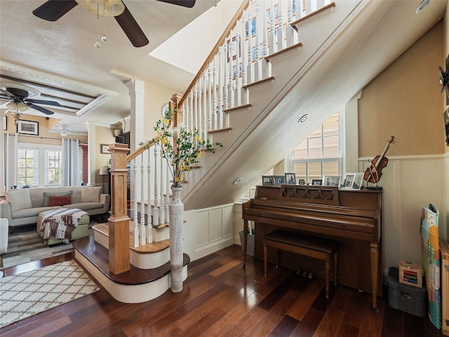 2504 W N A St Unit A, Tampa, FL 33609 - staircase featuring a ceiling fan, a decorative wall, wood finished floors, and a wainscoted wall