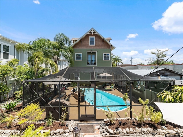 2504 W N A St Unit A, Tampa, FL 33609 - rear view of house with a patio and glass enclosure