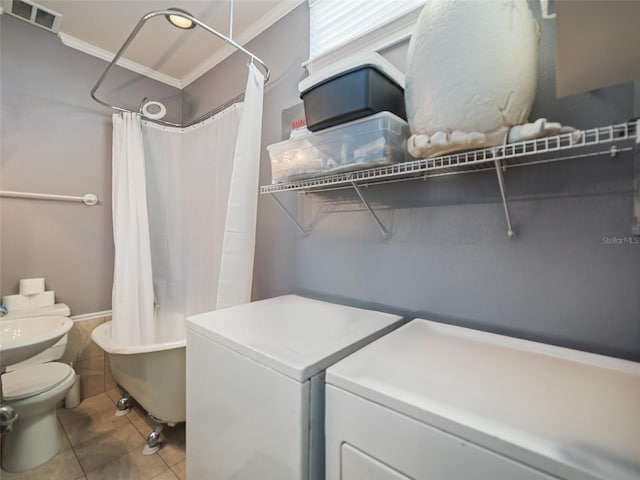 2504 W N A St Unit A, Tampa, FL 33609 - laundry area with independent washer and dryer and tile patterned flooring