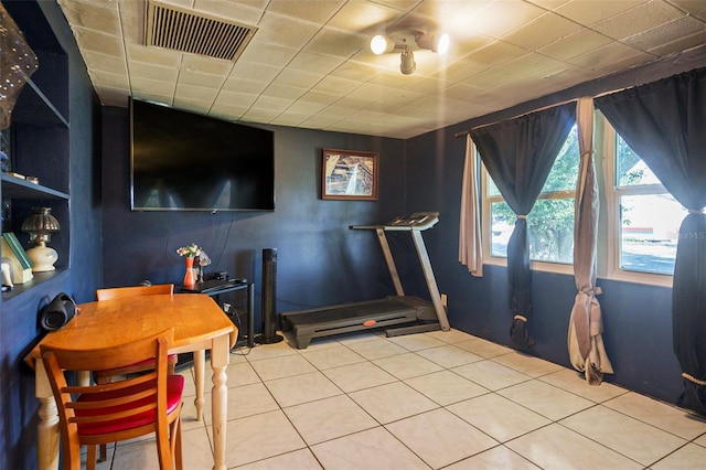 5651 6th St, Zephyrhills, FL 33542 - workout area with tile patterned flooring