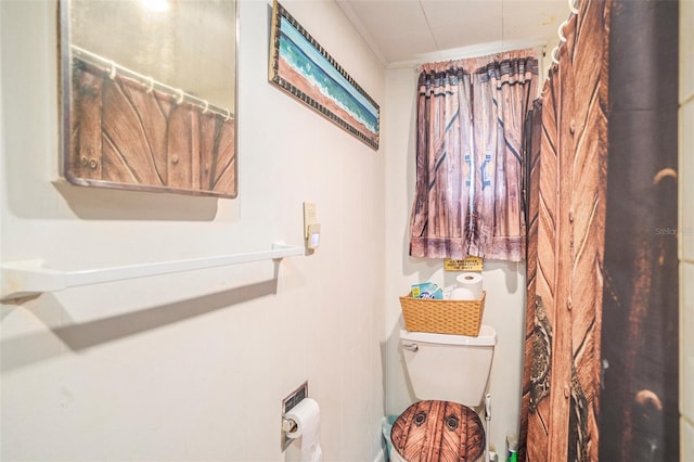 5651 6th St, Zephyrhills, FL 33542 - bathroom with toilet and a shower with shower curtain
