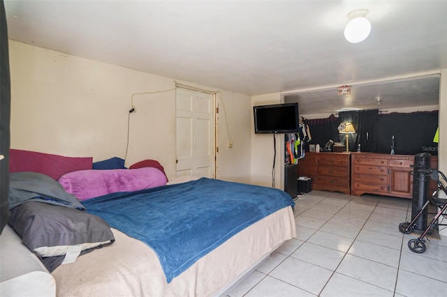 5651 6th St, Zephyrhills, FL 33542 - bedroom featuring light tile patterned floors and a closet