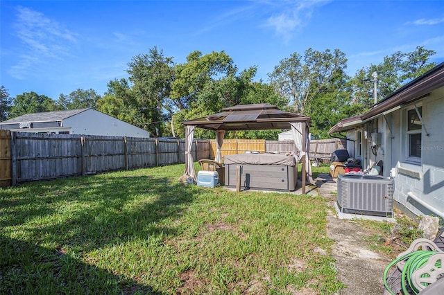5651 6th St, Zephyrhills, FL 33542 - fenced backyard featuring a gazebo and a hot tub