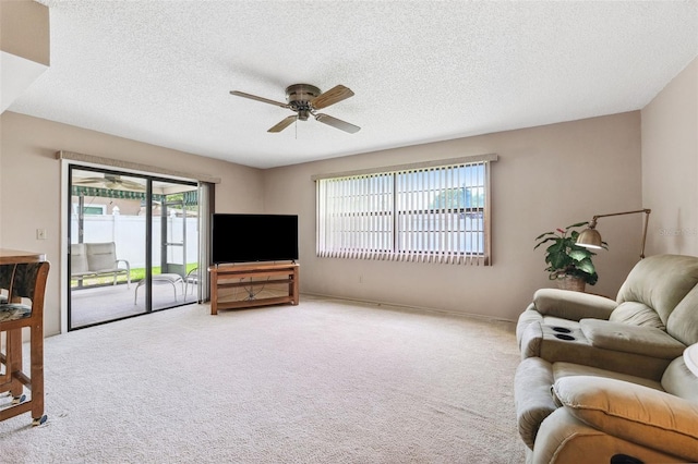 12156 Meadowbrook Ln, Largo, FL 33774 - carpeted living area featuring ceiling fan and a textured ceiling
