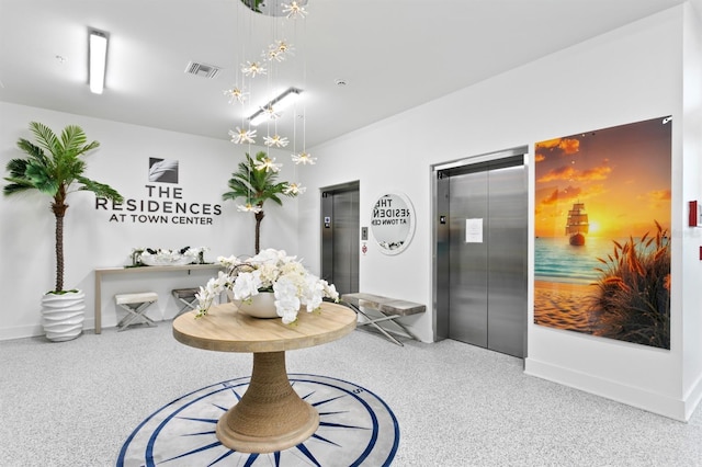 400 150th Ave Unit 205, Madeira Beach, FL 33708 - dining space featuring elevator and speckled floor