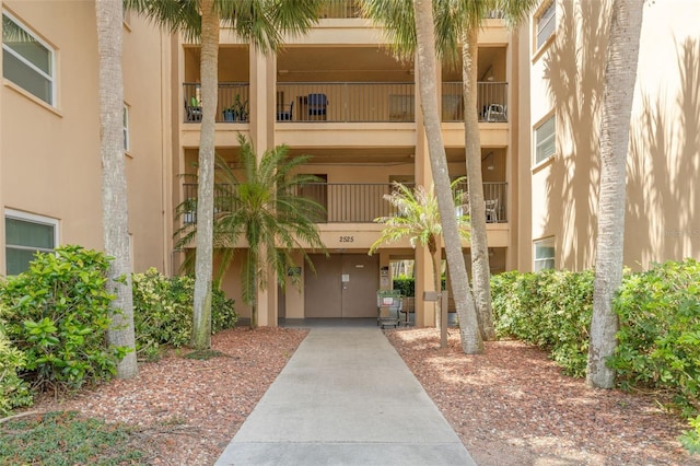 2525 W Bay Dr Unit A46, Largo, FL 33770 - doorway to property featuring stucco siding