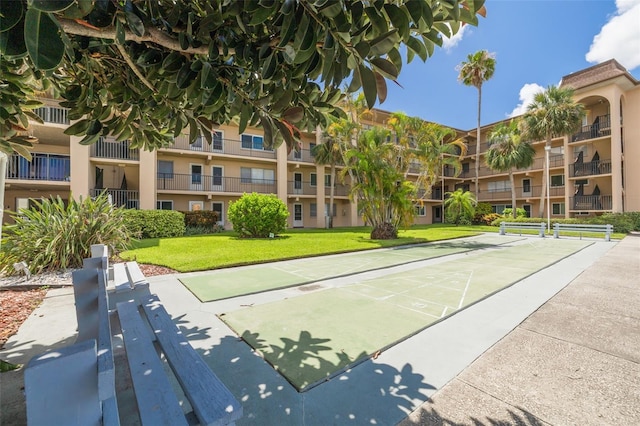2525 W Bay Dr Unit A46, Largo, FL 33770 - view of home's community with a lawn and shuffleboard