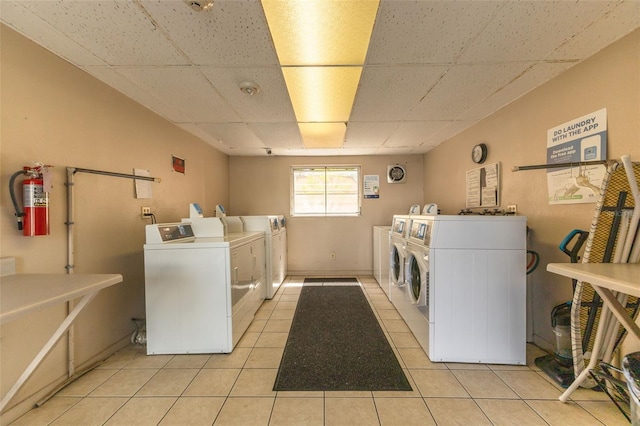 2525 W Bay Dr Unit A46, Largo, FL 33770 - shared laundry room with separate washer and dryer and light tile patterned floors