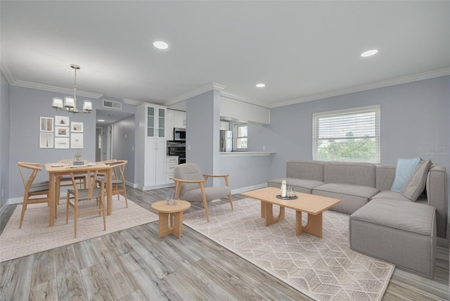 2525 W Bay Dr Unit A46, Largo, FL 33770 - living room featuring crown molding, a chandelier, light wood-type flooring, and recessed lighting
