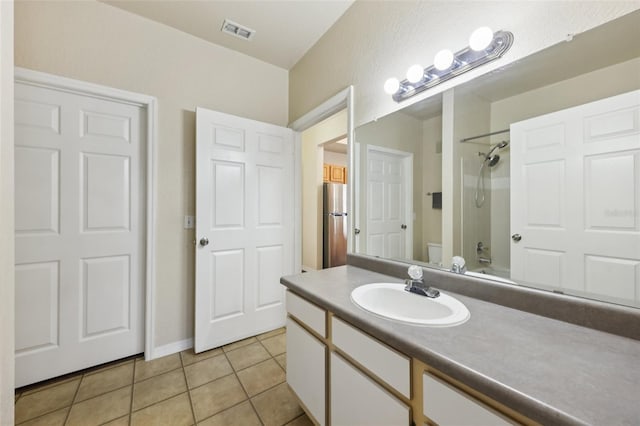 6017 Westgate Dr Unit 924, Orlando, FL 32835 - bathroom featuring vanity, tile patterned floors, and shower / washtub combination