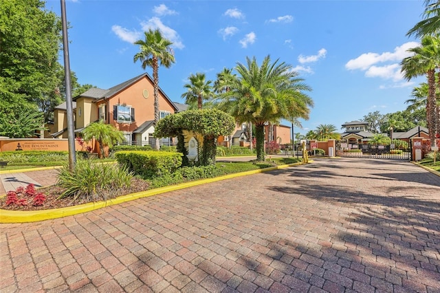 6017 Westgate Dr Unit 924, Orlando, FL 32835 - view of front of house with a gate and stucco siding