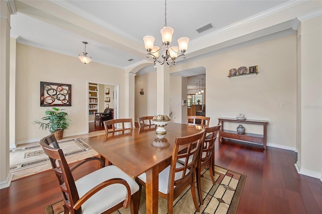 11729 Newberry Grove Loop, Riverview, FL 33579 - dining room featuring decorative columns, arched walkways, crown molding, hardwood / wood-style flooring, and a chandelier