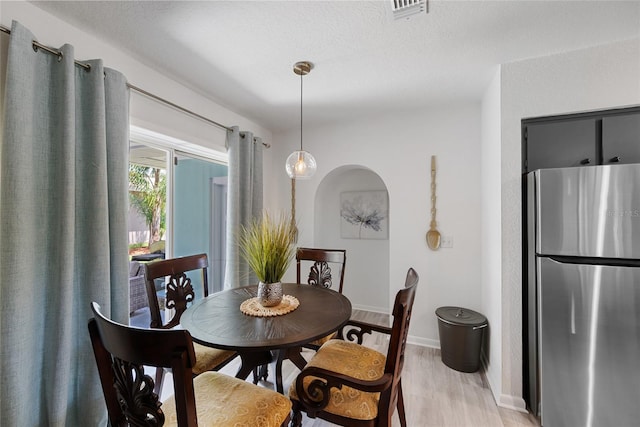 1711 N Highland Ave, Clearwater, FL 33755 - dining area featuring light wood-style flooring and baseboards