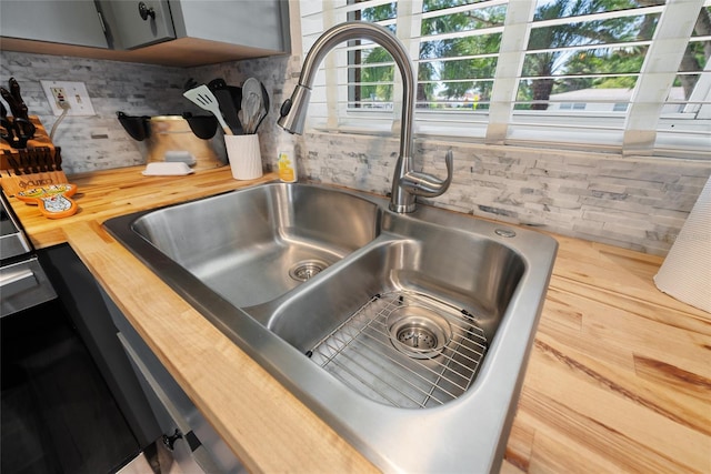 1711 N Highland Ave, Clearwater, FL 33755 - kitchen view of butcher block counters and tasteful backsplash