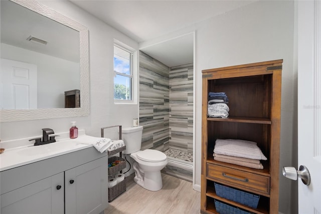 1711 N Highland Ave, Clearwater, FL 33755 - bathroom featuring vanity, a shower stall, and wood finished floors