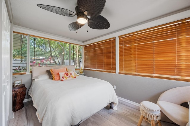 1711 N Highland Ave, Clearwater, FL 33755 - bedroom with wood finished floors and ceiling fan