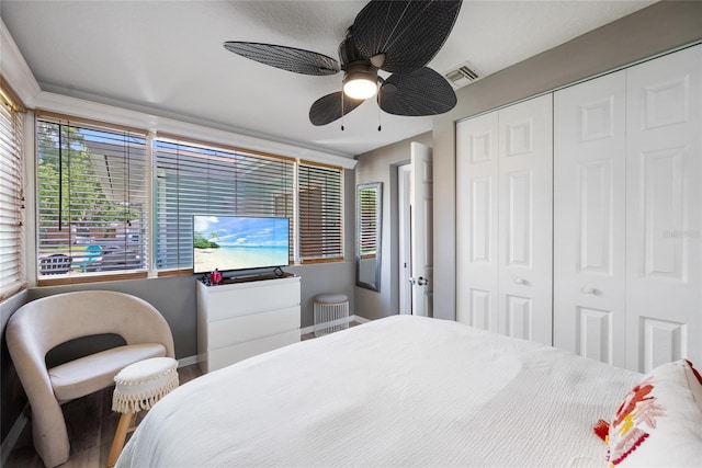 1711 N Highland Ave, Clearwater, FL 33755 - bedroom featuring a closet, wood finished floors, and ceiling fan
