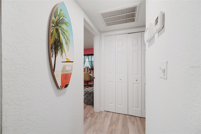 1711 N Highland Ave, Clearwater, FL 33755 - hallway featuring light wood-style floors and a textured wall