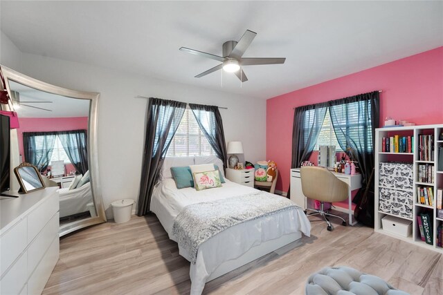 1711 N Highland Ave, Clearwater, FL 33755 - bedroom with light wood finished floors and a ceiling fan
