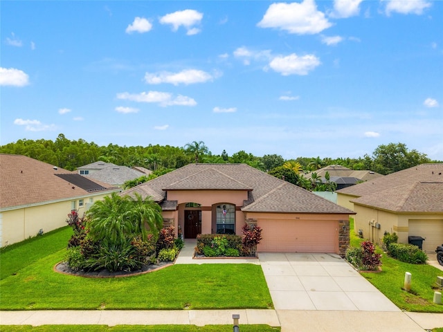 3246 Brenford Pl, Land O Lakes, FL 34638 - view of front of house featuring a garage, stucco siding, driveway, and a front lawn