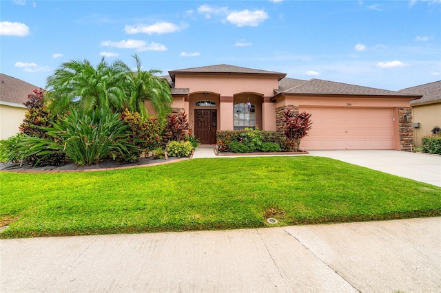 3246 Brenford Pl, Land O Lakes, FL 34638 - mediterranean / spanish home featuring concrete driveway, an attached garage, stucco siding, and a front lawn