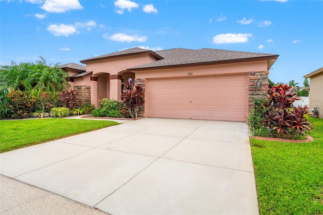3246 Brenford Pl, Land O Lakes, FL 34638 - view of front of property with stone siding, an attached garage, a front yard, and concrete driveway